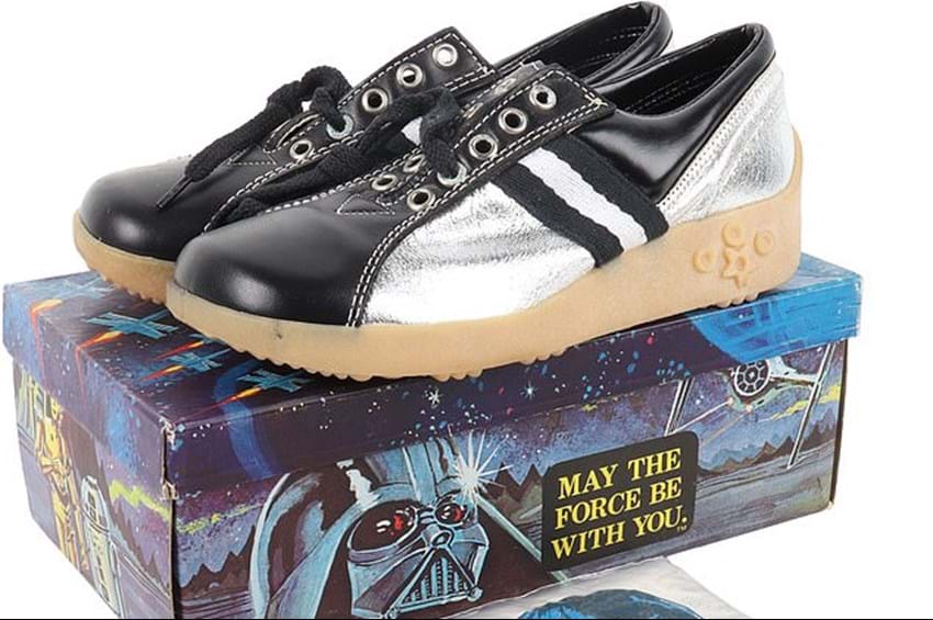In an auction house far, far away...Couple's lifetime collection of 250 Star Wars toys, themed bubblegum, trainers, and rollerskates sell for £84,000